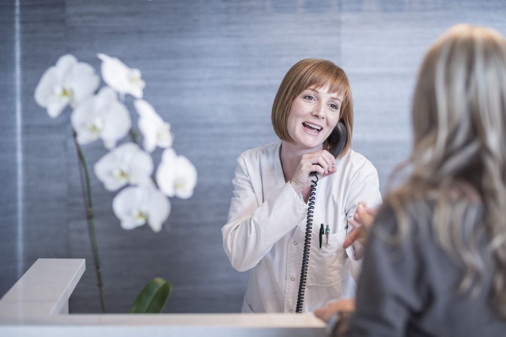 receptionist greeting patient while on the phone 2026 01 05 01 12 24 utc scaled